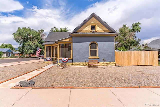 view of front of house with a sunroom