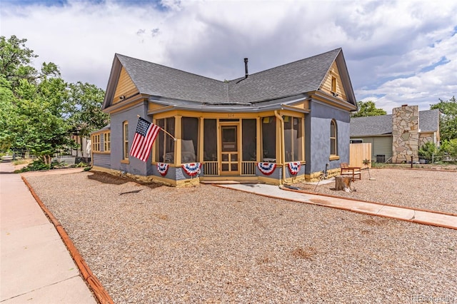 exterior space with a sunroom and a patio area