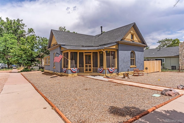 view of front of property featuring a sunroom