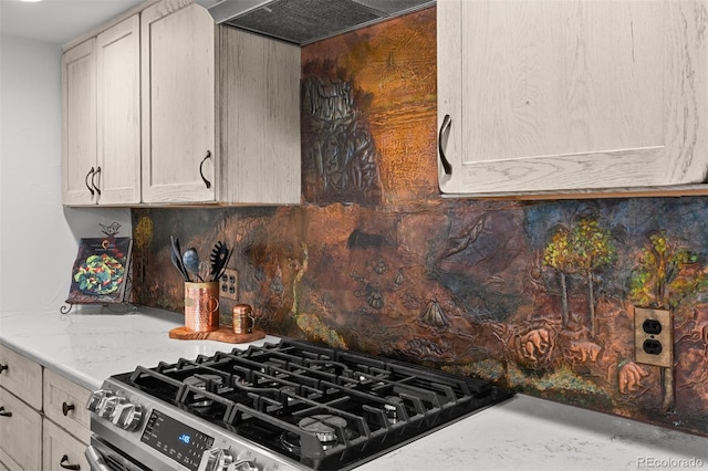 245 N County Highway 67, Sedalia, CO 80135 - kitchen featuring stainless steel range with gas stovetop, backsplash, exhaust hood, and light stone countertops