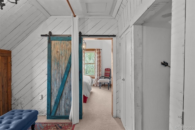 245 N County Highway 67, Sedalia, CO 80135 - hallway featuring light colored carpet, vaulted ceiling, and wooden walls