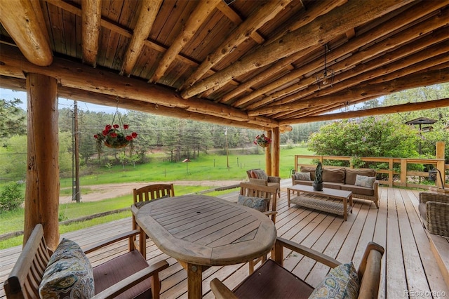 245 N County Highway 67, Sedalia, CO 80135 - deck featuring an outdoor hangout area, a lawn, and outdoor dining space