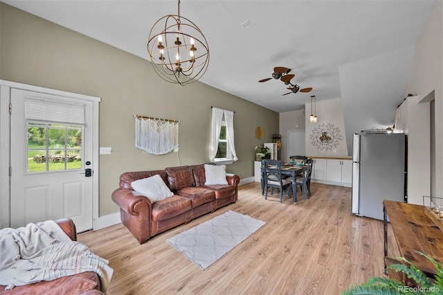 245 N County Highway 67, Sedalia, CO 80135 - living room with light wood-type flooring, a chandelier, ceiling fan, and vaulted ceiling
