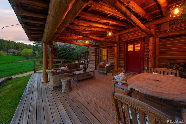 245 N County Highway 67, Sedalia, CO 80135 - deck at dusk featuring outdoor lounge area and a lawn