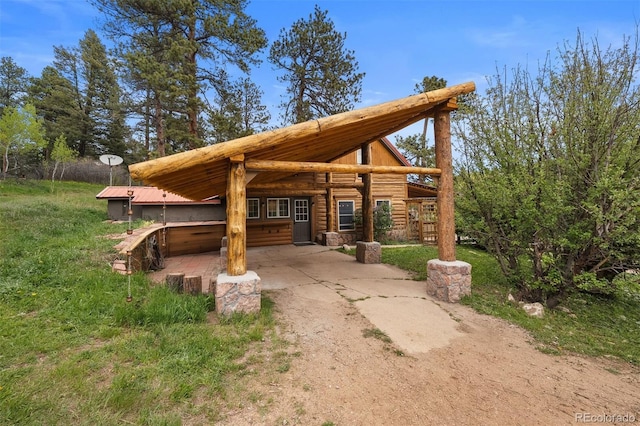 245 N County Highway 67, Sedalia, CO 80135 - view of patio featuring driveway