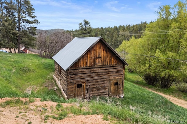 245 N County Highway 67, Sedalia, CO 80135 - view of outbuilding with a forest view