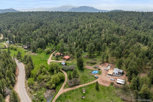245 N County Highway 67, Sedalia, CO 80135 - aerial overview of property's location with a heavily wooded area and mountains