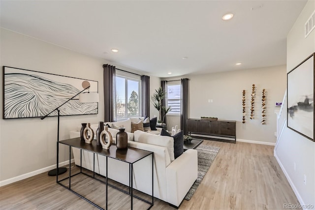 living room with light hardwood / wood-style floors