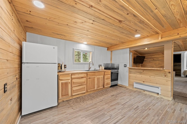 15535 S Elk Creek Rd, Pine, CO 80470 - kitchen with freestanding refrigerator, high end stove, a baseboard heating unit, a sink, and wood ceiling