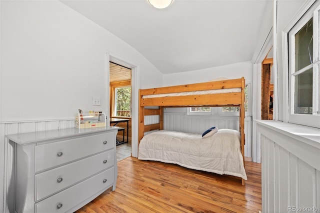 15535 S Elk Creek Rd, Pine, CO 80470 - bedroom featuring vaulted ceiling and light wood-style flooring