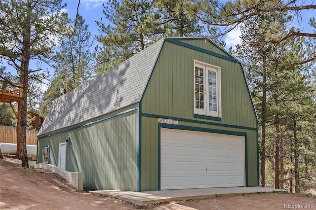 15535 S Elk Creek Rd, Pine, CO 80470 - garage featuring a garage and dirt driveway