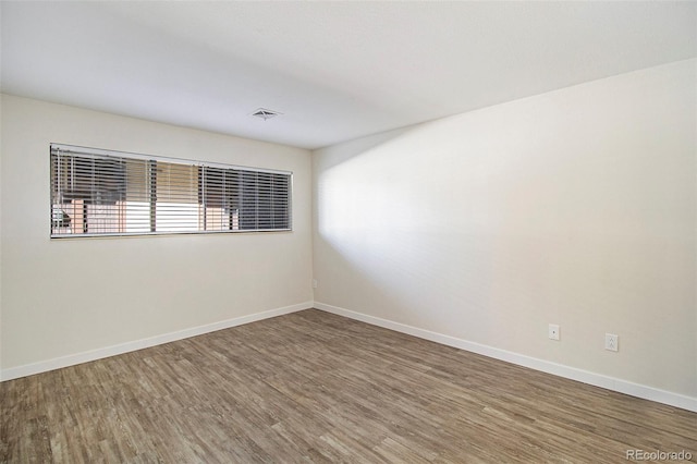 500 Manhattan Dr Unit B1, Boulder, CO 80303 - unfurnished room with wood finished floors and baseboards
