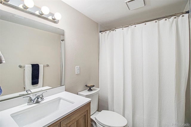 500 Manhattan Dr Unit B1, Boulder, CO 80303 - full bath with toilet, vanity, and a textured wall