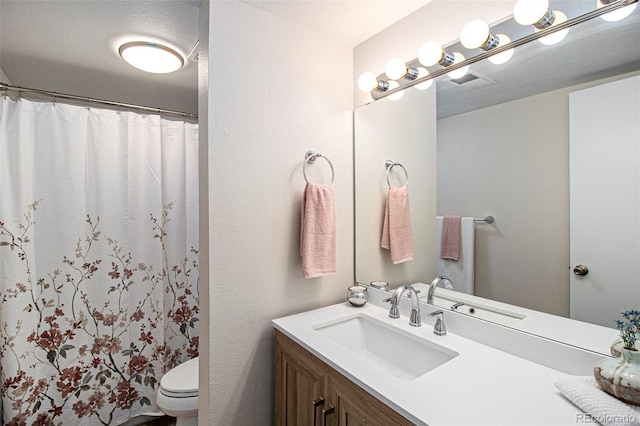 500 Manhattan Dr Unit B1, Boulder, CO 80303 - full bathroom with vanity, toilet, and a shower with curtain