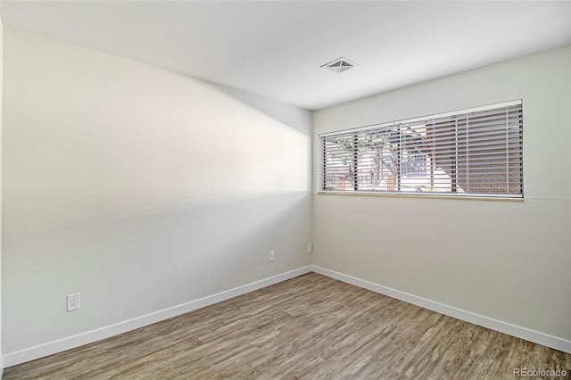 500 Manhattan Dr Unit B1, Boulder, CO 80303 - unfurnished room featuring wood finished floors and baseboards
