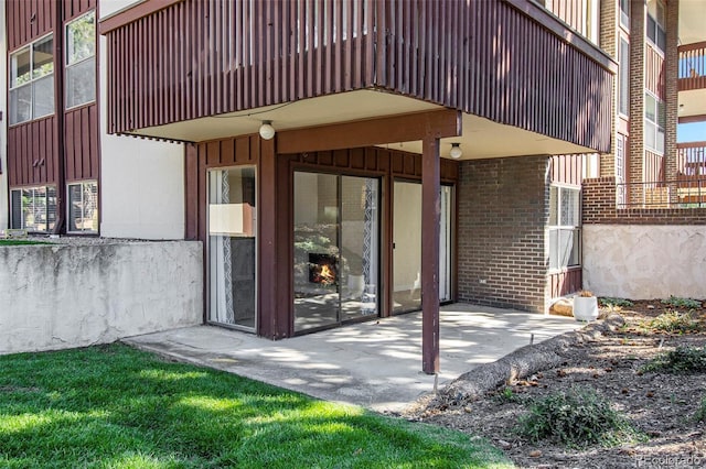 500 Manhattan Dr Unit B1, Boulder, CO 80303 - doorway to property with brick siding, a patio area, and board and batten siding