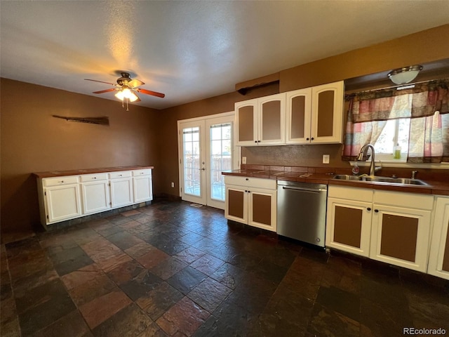 kitchen with ceiling fan, sink, dark tile flooring, and dishwasher