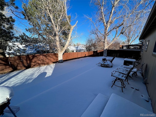 view of snow covered patio