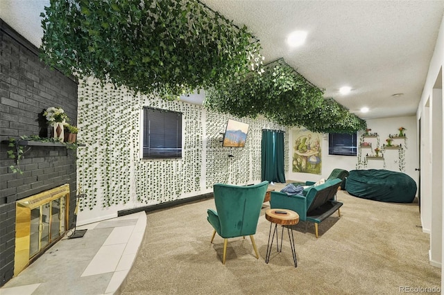 living room featuring carpet floors, an outdoor brick fireplace, and a textured ceiling