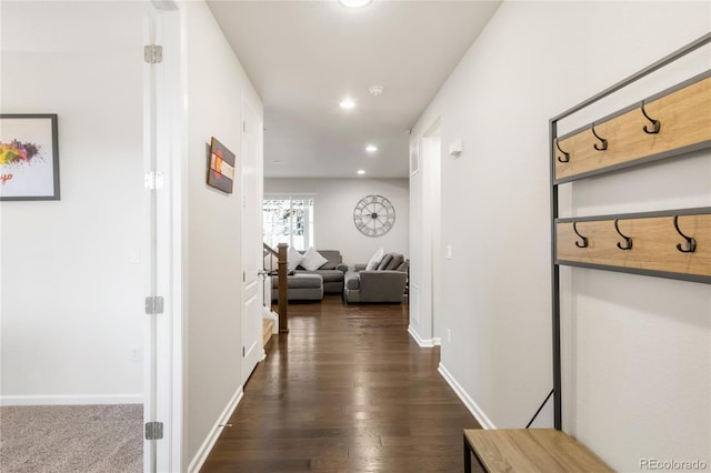 hallway with baseboards, dark wood-style flooring, and recessed lighting