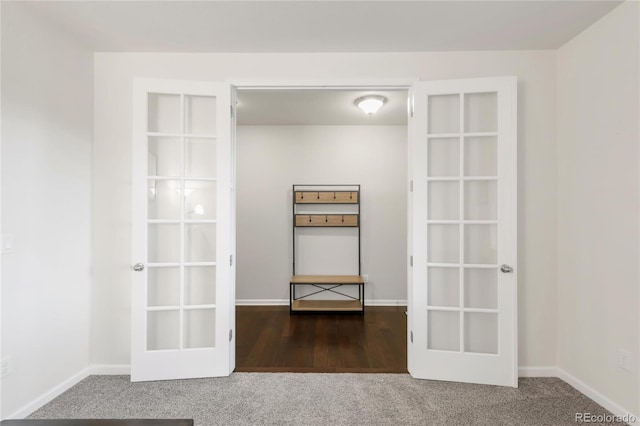 interior space with carpet floors and baseboards