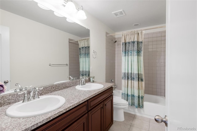 full bathroom featuring a sink, shower / bathtub combination with curtain, tile patterned floors, and toilet
