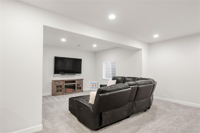 living room with baseboards, light carpet, and recessed lighting