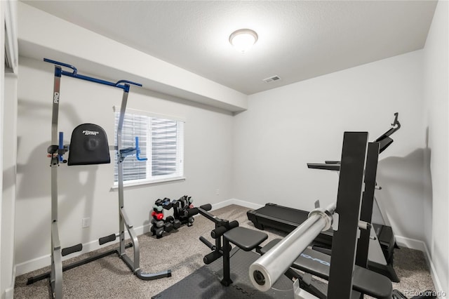 exercise room with baseboards