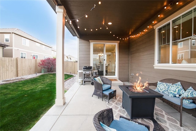 view of patio / terrace with a fenced backyard, an outdoor living space with a fire pit, and area for grilling