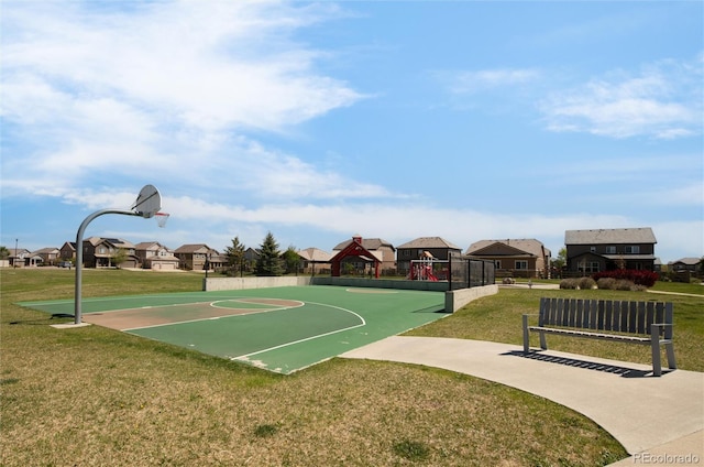 view of sport court with a lawn, community basketball court, and playground community