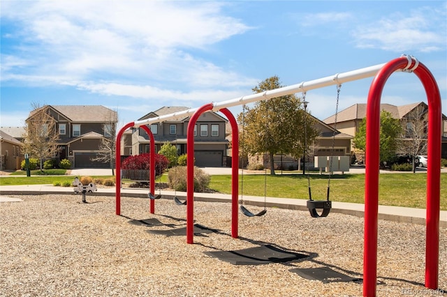community play area featuring a residential view and a lawn