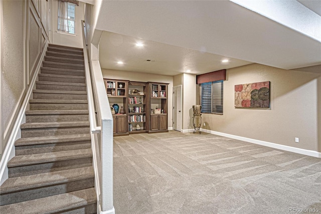 3534 Starry Night Loop, Castle Rock, CO 80109 - basement featuring stairway, light carpet, baseboards, recessed lighting, and a textured wall