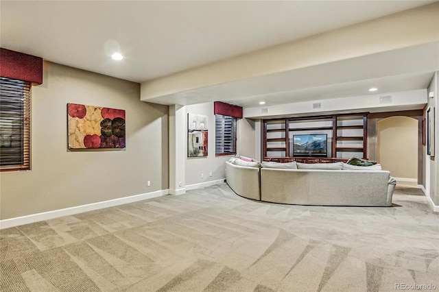 3534 Starry Night Loop, Castle Rock, CO 80109 - living area featuring light colored carpet, baseboards, arched walkways, and recessed lighting