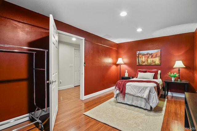 bedroom with wood-type flooring