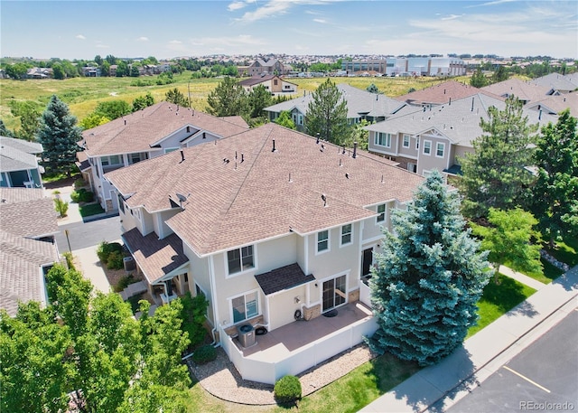 birds eye view of property with a residential view