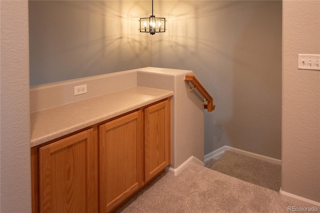 bathroom with a textured wall and baseboards