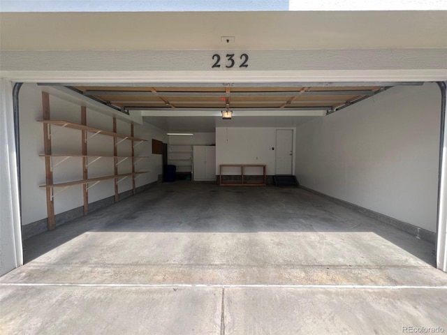 garage featuring baseboards