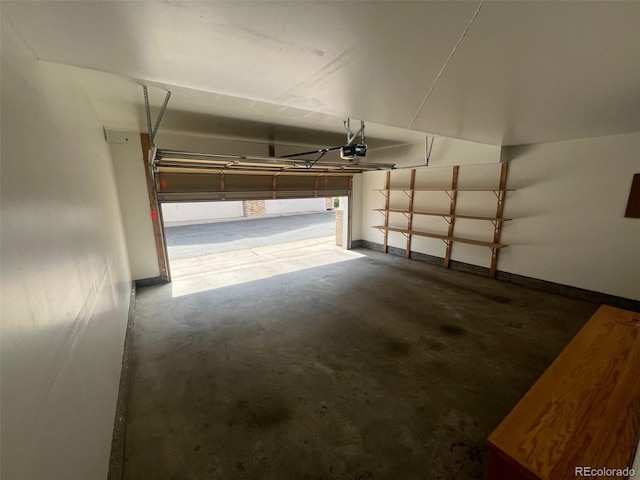 garage featuring baseboards and a garage door opener