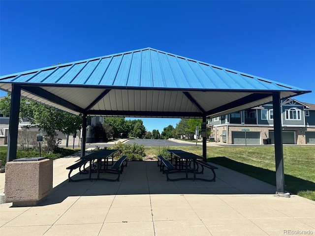 view of home's community featuring a patio area, a lawn, and a gazebo