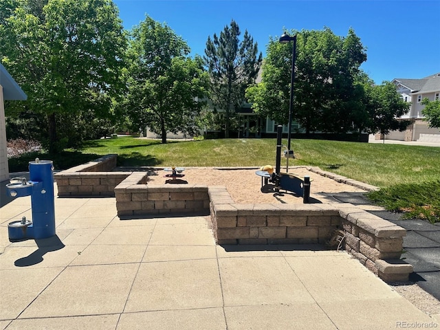 view of patio / terrace featuring a fire pit