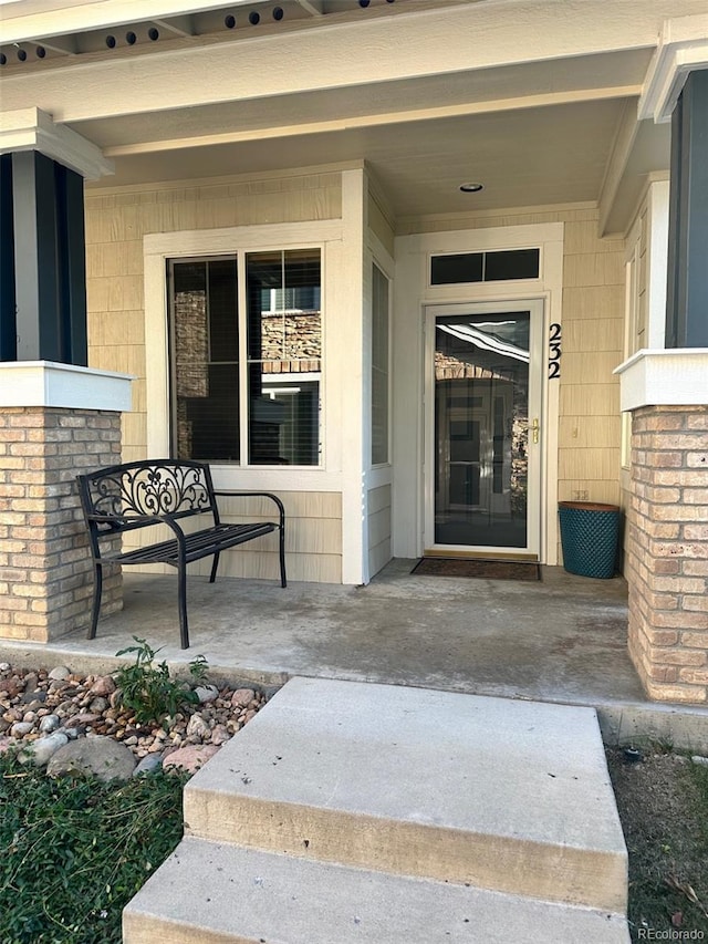 doorway to property featuring a porch