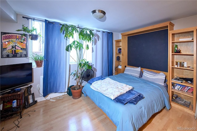 bedroom featuring wood finished floors