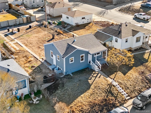 birds eye view of property with a residential view