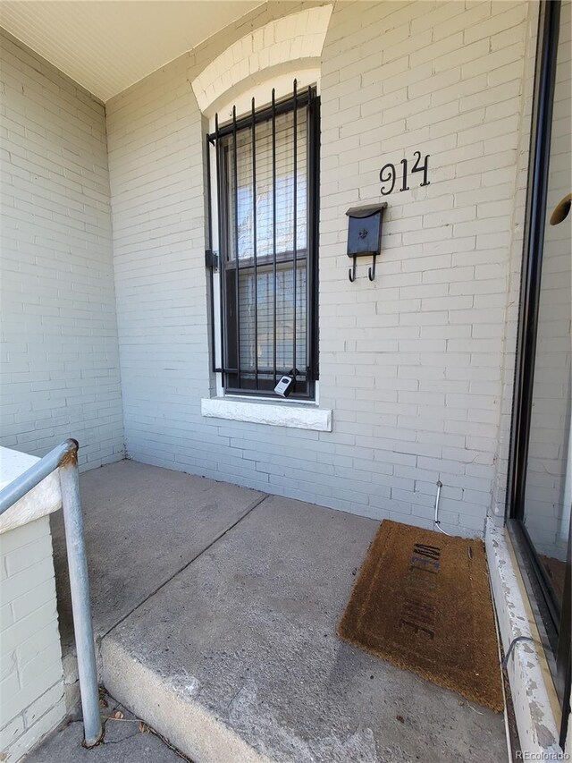 exterior space featuring brick siding