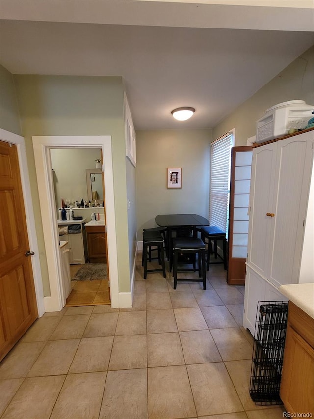 corridor with light tile patterned flooring