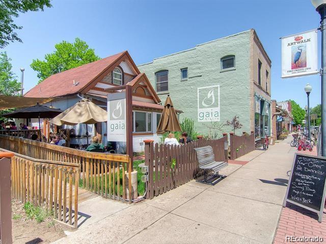 rear view of house featuring fence