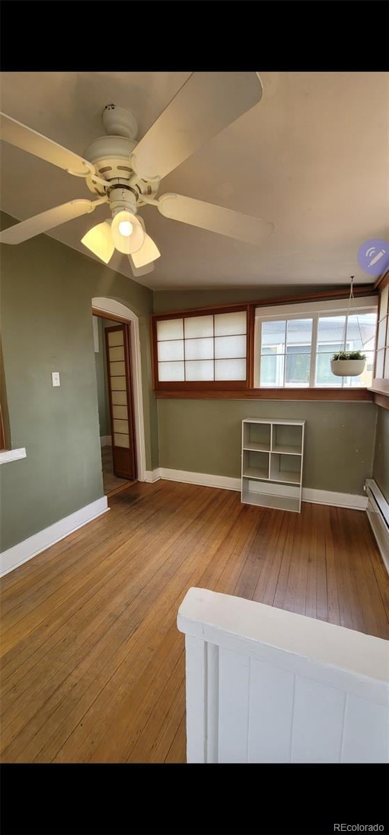 914 E Iowa Ave, Denver, CO 80210 - empty room with hardwood / wood-style flooring, a ceiling fan, and baseboards