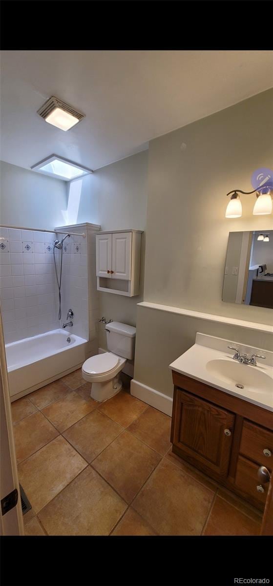 914 E Iowa Ave, Denver, CO 80210 - full bath with toilet, bathtub / shower combination, vanity, and tile patterned flooring