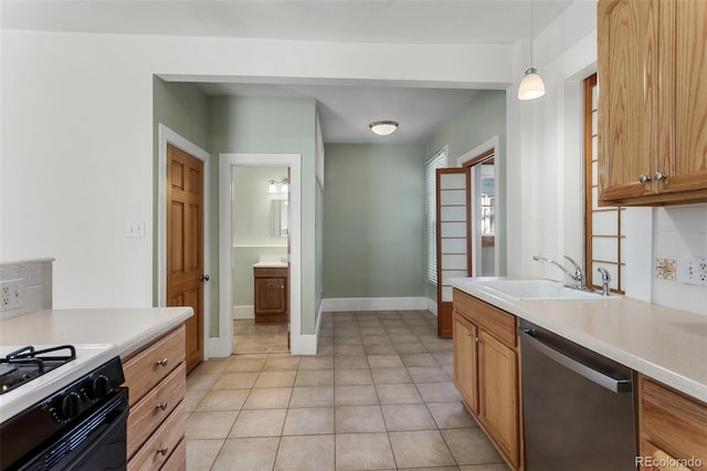 914 E Iowa Ave, Denver, CO 80210 - kitchen featuring stainless steel dishwasher, light countertops, decorative light fixtures, black gas range oven, and light tile patterned floors