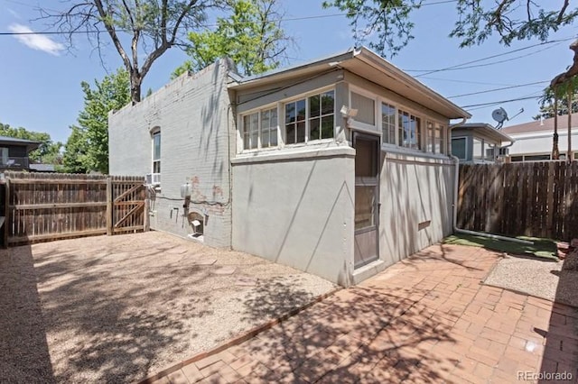 914 E Iowa Ave, Denver, CO 80210 - view of side of home with a patio